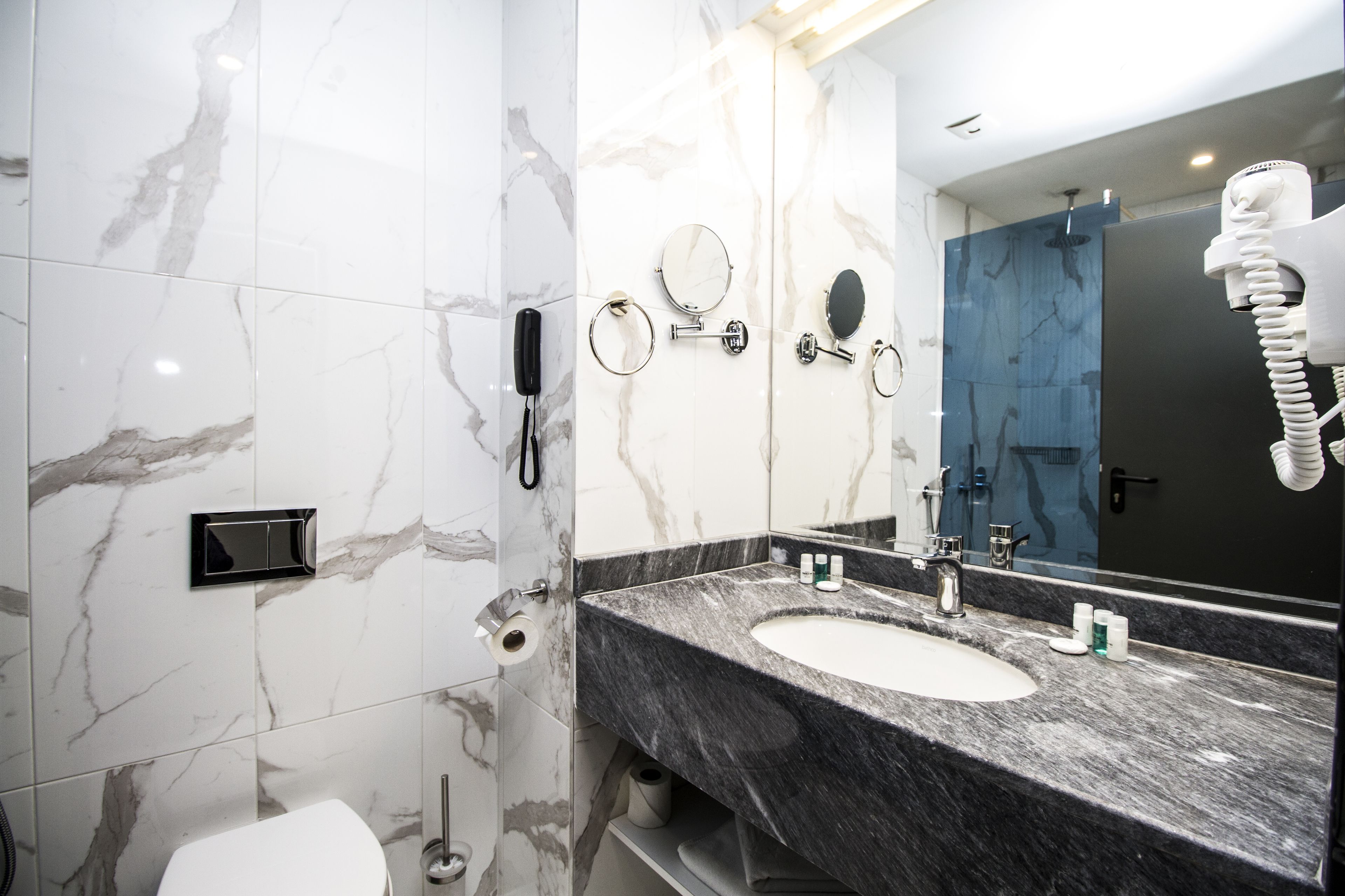 combined shower/bathtub, rainfall showerhead, designer toiletries