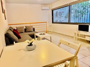 Apartment, 1 Bedroom, Ground Floor | Living area | 25-inch flat-screen TV with digital channels, TV - Elvita Apartments (Athens)