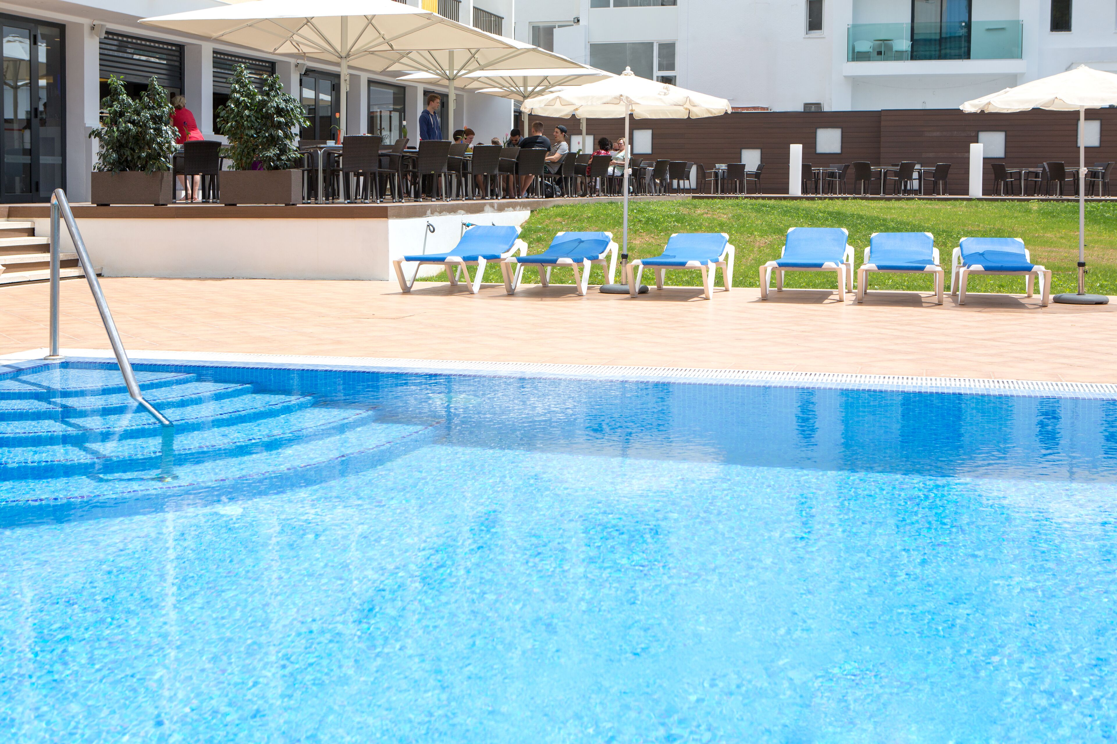 seasonal outdoor pool, open 9:00 am to 8:00 pm, pool umbrellas