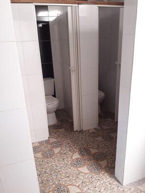 Family Room, Multiple Beds | Bathroom | Shower, towels, soap, toilet paper