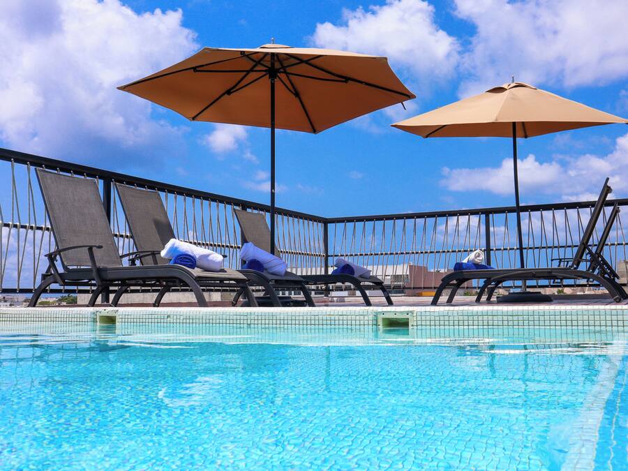 Outdoor pool, pool umbrellas, sun loungers