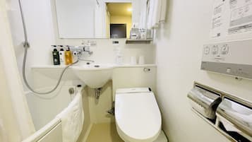 Combined shower/tub, free toiletries, hair dryer, slippers