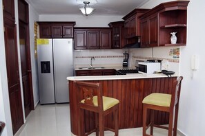 Microwave, coffee/tea maker, cookware/dishes/utensils