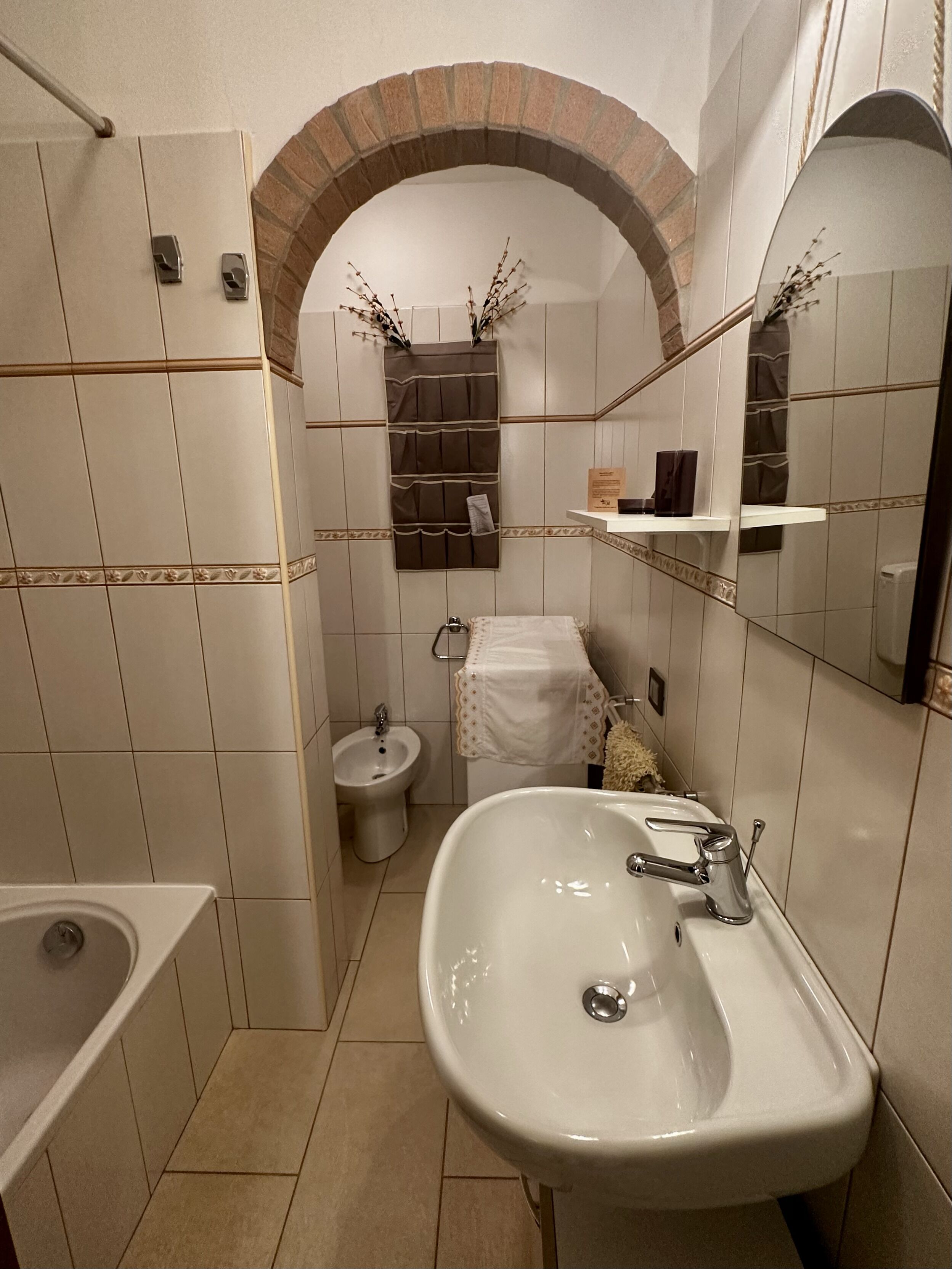 Bathtub, hair dryer, towels, toilet paper