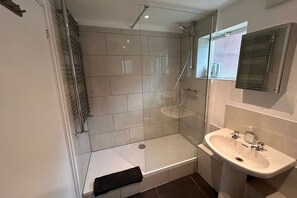 Combined shower/tub, hair dryer, towels, soap