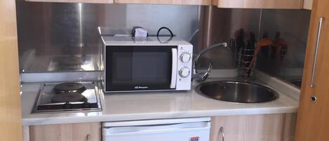 Microwave, coffee/tea maker, cookware/dishes/utensils