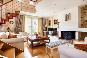 TV, fireplace, books, printers