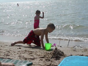 On the beach, sun-loungers