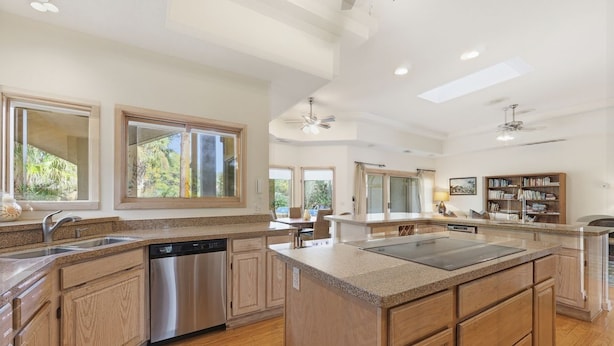 A spacious kitchen with wooden cabinets, a dishwasher, and a large island. - Beautiful Home, Close to Beach, Lagoon, Fantastic Pool! (Hilton Head Island)