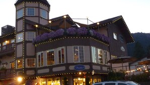 A multi-story building with a tower, large windows, and a sign that reads "Violet Lodge". - Leavenworth Vacation Rental, Luxury , Downtown,  Amazing Mountain View Condo,  (Leavenworth)