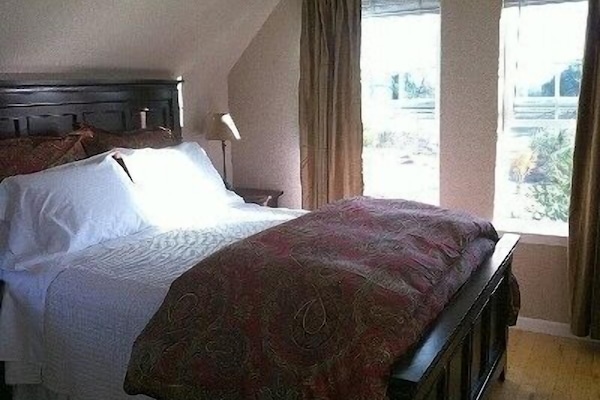 Bedroom looking out over garden and pasture