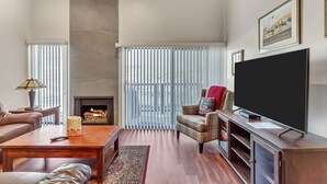 A modern living room with a fireplace, a television, and a comfortable seating area. - Ski-in/Ski-Out, Walk to Main St. Clean, Spacious, REMODELED,  Arts Festvl. A/C (Park City)