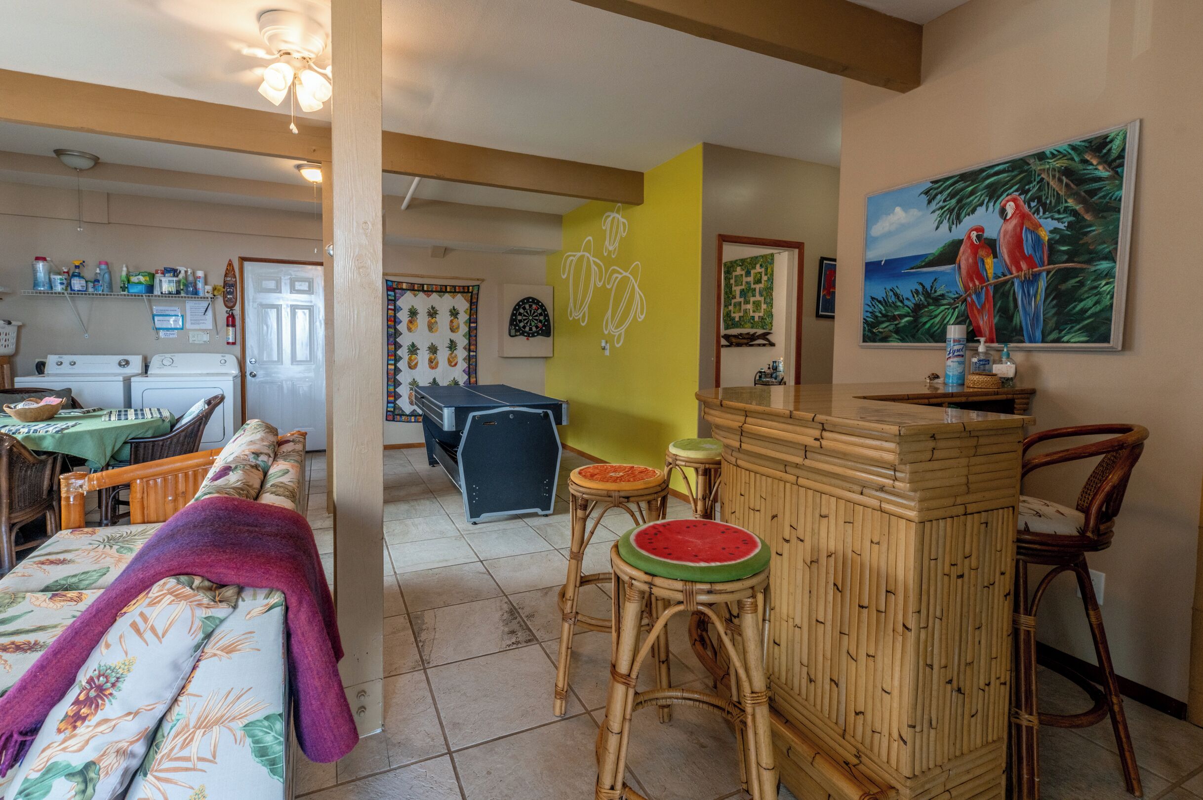 A room with a dining area, a kitchen, and a living space.