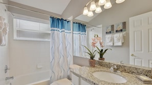 Combined shower/tub, hair dryer, towels, toilet paper