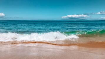 On the beach, sun loungers, beach towels