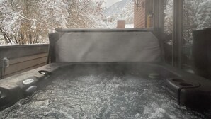 A hot tub with a view of snow-covered trees and a mountain in the background. - Great location, quick drive to Snowbird Alta, Brighton Solitude, walk to dinner (Cottonwood Heights)