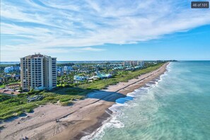 On the beach, sun-loungers, beach towels - Luxury Ocean Village Beach Condo with 5 Star Reviews with Wifi and all Extras (Fort Pierce)