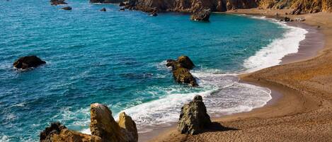 On the beach, sun-loungers, beach towels