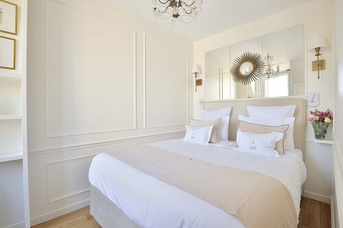 Elegant 1BR on Rue Cler w/Market Street Charm & Balcony Views