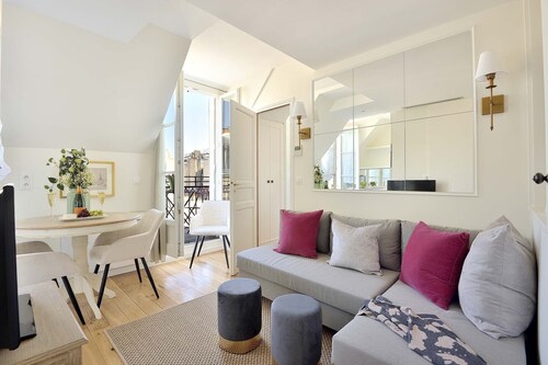 Elegant 1BR on Rue Cler w/Market Street Charm & Balcony Views