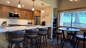 Coffee/tea maker, fridge, microwave, oven