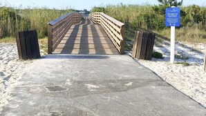 A concrete bridge leading to a beach area with a sign indicating 'Little Lagoon Pass Park Fishing Per Improvements'. - 3BR/3BA - Beach, pool, lagoon front and MORE!  (Gulf Shores)