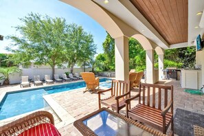 A poolside area with lounge chairs, a wooden bench, and a pergola structure. - Venetian Palace | Frangista Beach Mediterranean Home | Paws Welcome + Short Walk to the Beach! (Miramar Beach)