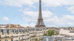The Eiffel Tower with surrounding Parisian architecture. - Stunning & Bright, Sleeps 6, w/Big Balcony and Amazing Paris Views (Paris)