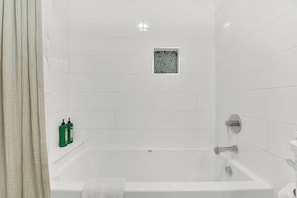 Combined shower/bathtub, hair dryer, towels, soap
