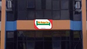 A building with a 'Mini Budget Inn' sign and a 'PP' logo. - Miri Budget Inn (Miri)
