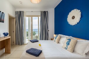 Romantic Double Room, Ocean View | In-room safe, iron/ironing board, free WiFi, bed sheets