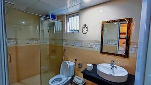 Designer toiletries, slippers, bidet, towels