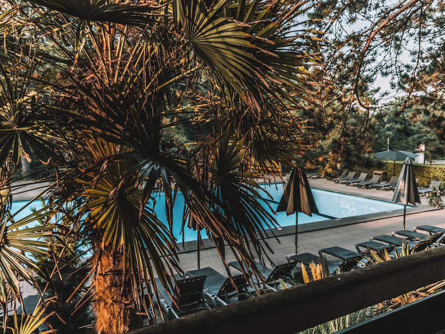 Seasonal outdoor pool, open 9:00 AM to 9:00 PM, pool umbrellas