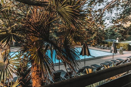 Seasonal outdoor pool, open 9:00 AM to 9:00 PM, pool umbrellas