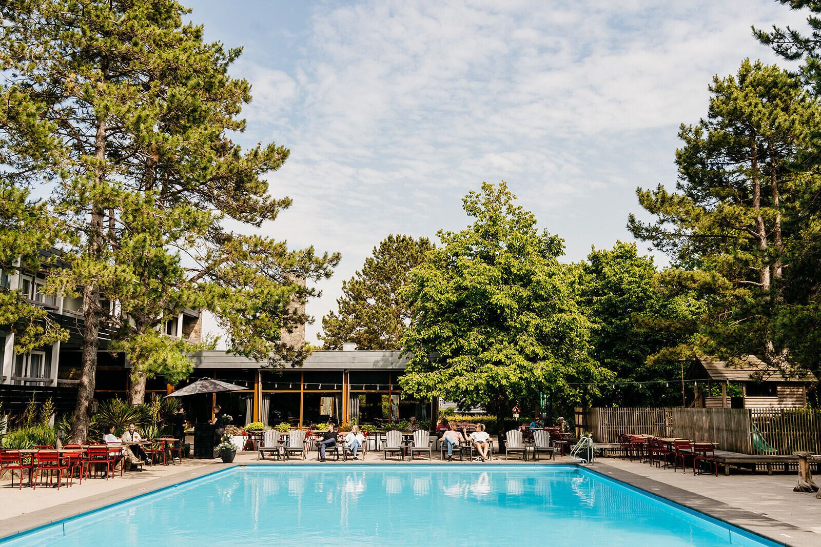 Seasonal outdoor pool, open 9:00 AM to 9:00 PM, pool umbrellas