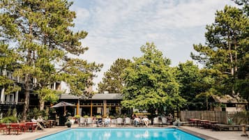 Seasonal outdoor pool, open 9:00 AM to 9:00 PM, pool umbrellas