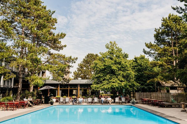 Seasonal outdoor pool, open 9:00 AM to 9:00 PM, pool umbrellas