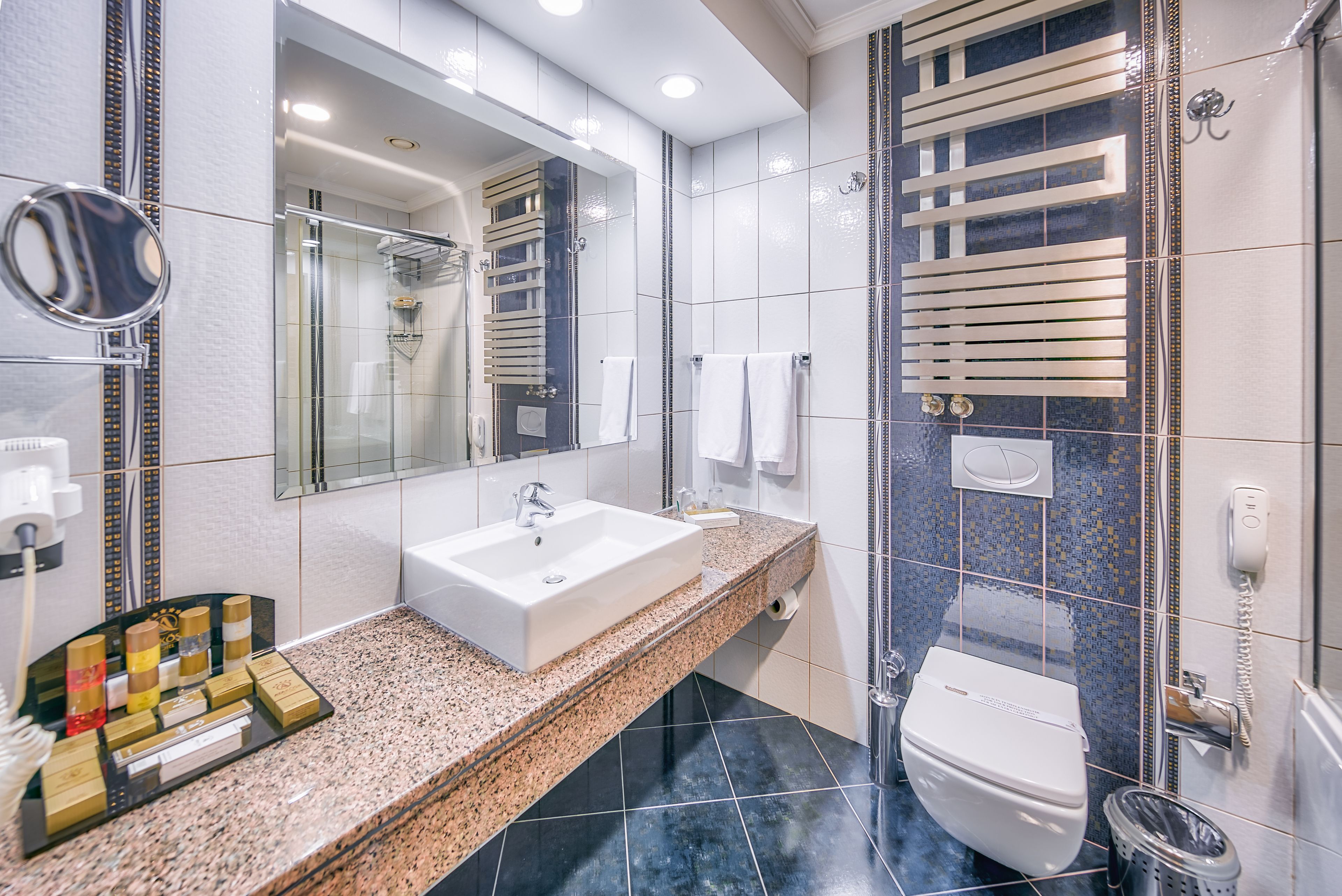 room, corner | bathroom | rainfall showerhead, eco-friendly toiletries, hair dryer, bathrobes