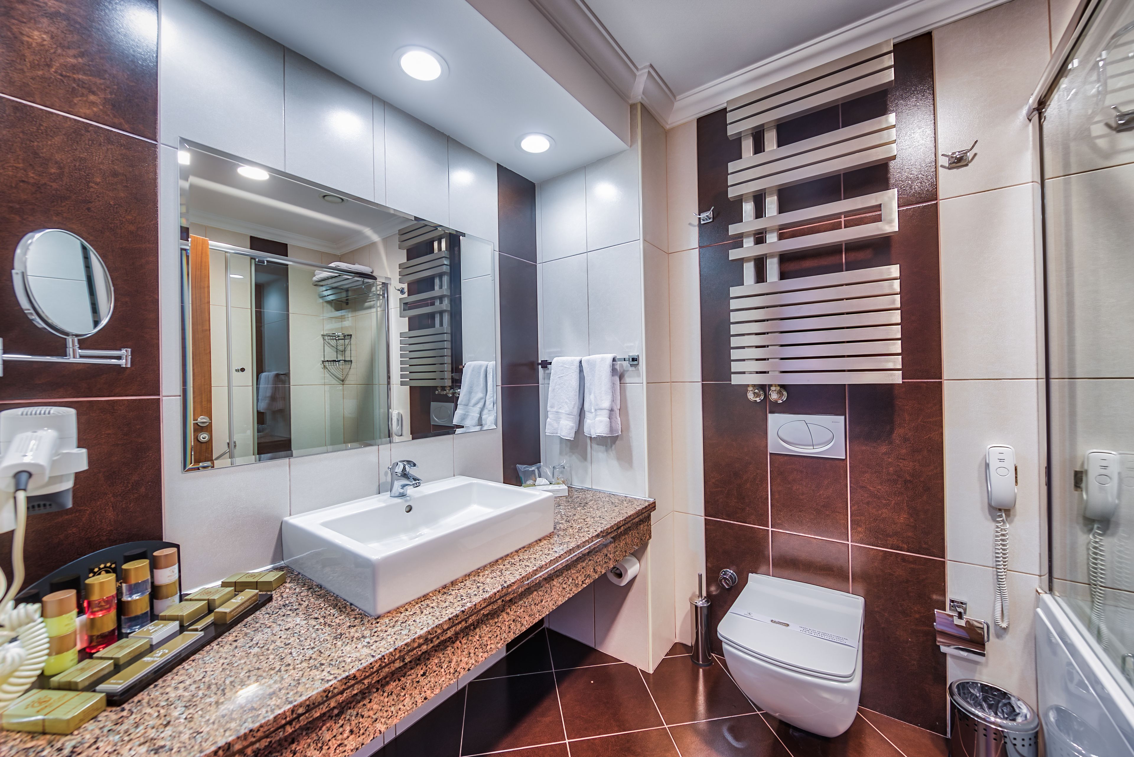standard double or twin room | bathroom | rainfall showerhead, eco-friendly toiletries, hair dryer, bathrobes
