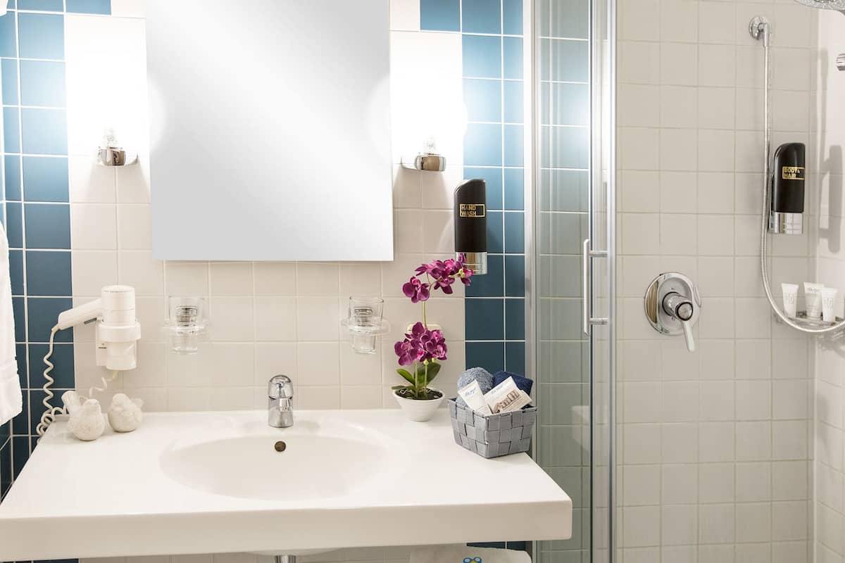 comfort double room, 1 bedroom, balcony, resort view | bathroom | shower, free toiletries, hair dryer, towels