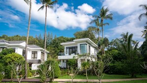 A modern two-story house with a balcony, surrounded by lush greenery and palm trees. - 2 Br Luxury Villa SDV141 near the beachfront by Samui Dream Villas  (Koh Samui)