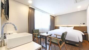 Habitación estándar | Ropa de cama de alta calidad y edredón