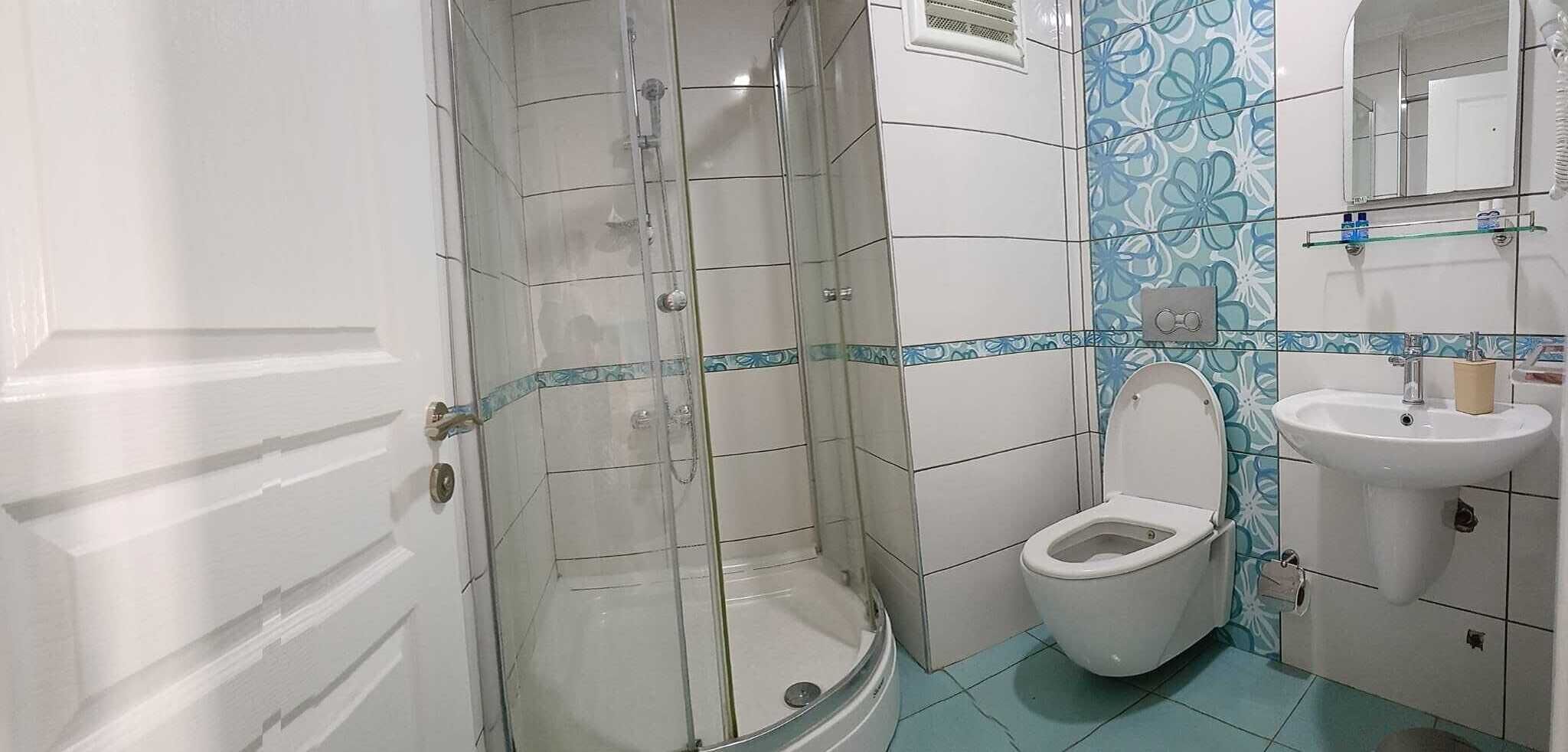 Shower, free toiletries, hair dryer, slippers