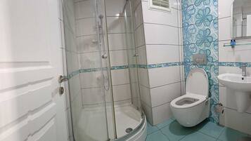 Shower, free toiletries, hair dryer, slippers