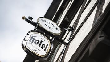 A hotel sign with "Schachtenburg" and "Hotel" written on it.