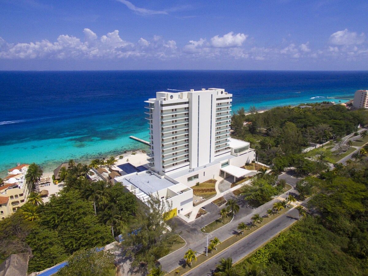 The high rise of the Westin Cozumel All Inclusive sits on the coast of the Caribbean giving stunning ocean views.