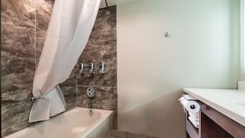 Combined shower/bathtub, designer toiletries, hair dryer, towels