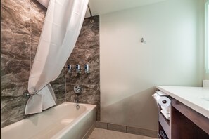 Combined shower/bathtub, designer toiletries, hair dryer, towels