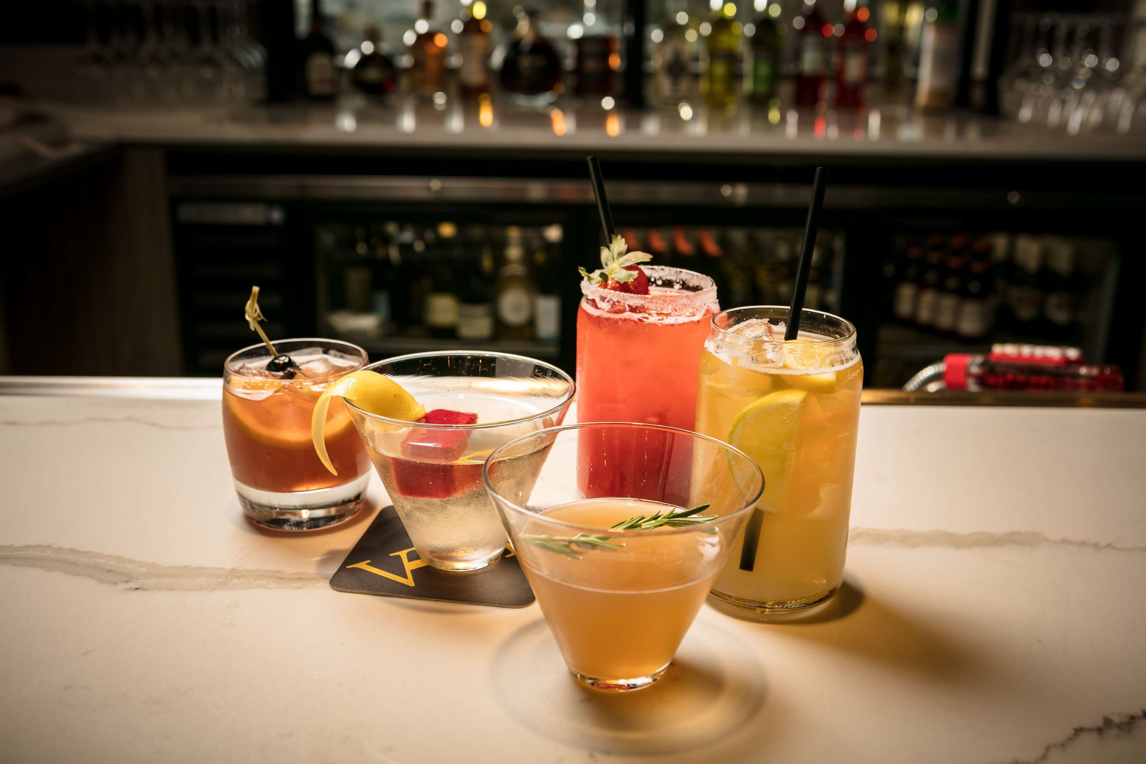 A bar area with various drinks and bottles.