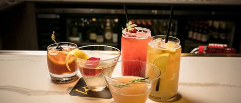 A bar area with various drinks and bottles.